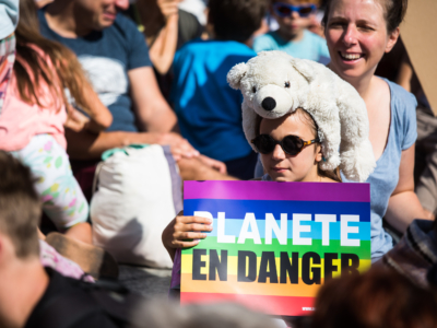 A girl with a white bear, at the march in Paris.